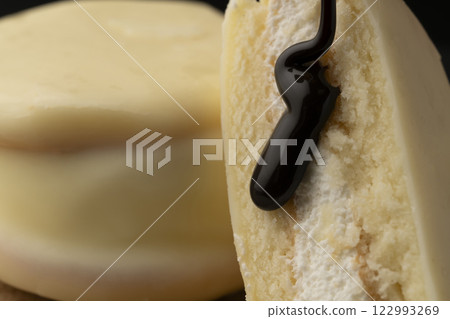 White chocolate cake with chocolate sauce White chocolate cake with chocolate sauce 122993269