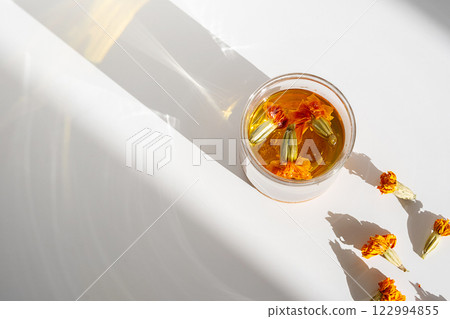 Glass of Wholesome Marigold Herbal Tea. 122994855