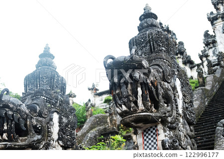 Ancient lion stucco statue is god and belief in Hindu with religion and culture decorated outdoor front stone stair of Pura Luhur Lempuyang Temple in Bali, Indonesia Ancient lion stucco statue is god and belief in Hindu with religion and culture decorated outdoor front stone stair of Pura Luhur Lempuyang Temple in Bali, Indonesia 122996177