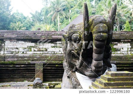 Ancient elephant stucco statue is god and belief in Hindu with religion and culture decorated outdoor front arched entrance in Bali, Indonesia 122996180