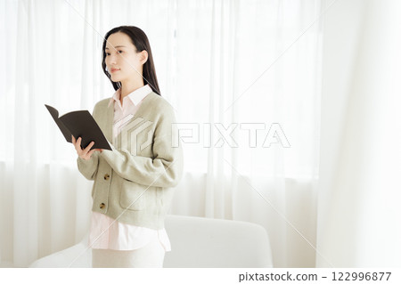 Businesswoman rereading her notes Businesswoman rereading her notes 122996877
