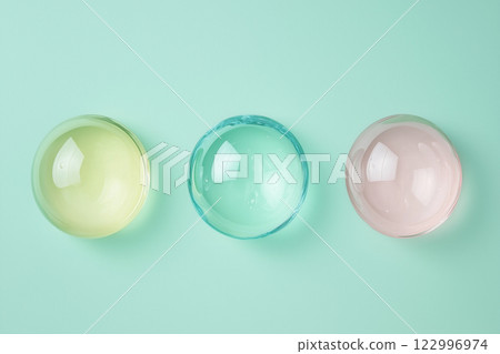three transparent glass balls of different colors 122996974