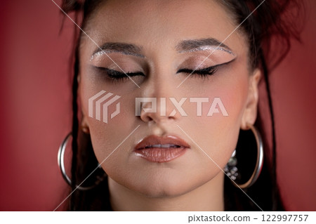 Explore elegant makeup with glitter and bold eyeliner for stunning, eyecatching looks Explore elegant makeup with glitter and bold eyeliner for stunning, eyecatching looks 122997757