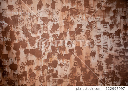 Textured Brown Wall Featuring an Intriguing Abstract Pattern That Captivates the Eye 122997997