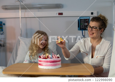 Were celebrating joy in a hospital room filled with cake, smiles, and laughter 122998090