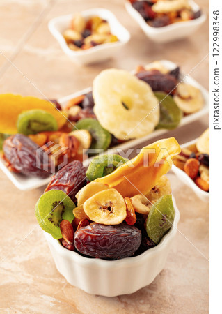 Dried tropical fruits with various nuts and raisins. 122998348