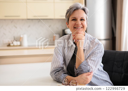 Portrait of a beautiful, well-groomed woman pensioner aged.  122998729