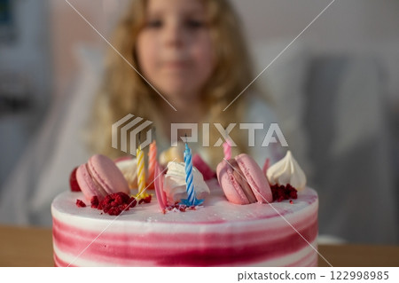 A beautifully designed, celebratory birthday cake adorned with colorful and vibrant decorations A beautifully designed, celebratory birthday cake adorned with colorful and vibrant decorations 122998985