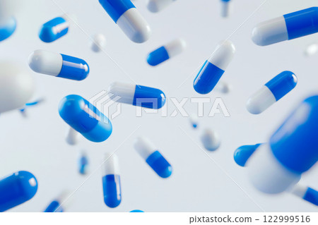 Blue pills and capsules floating in the air against a white background, illustrating medicine, and pharmaceutical concepts. 122999516