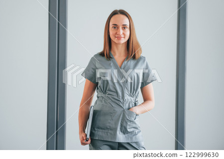 Woman standing in the studio 122999630