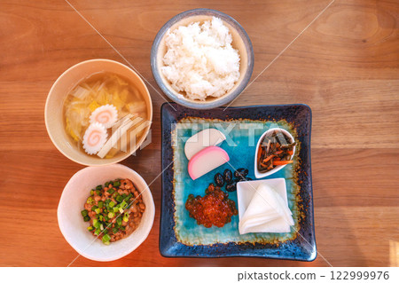 Japanese breakfast table: miso soup, rice and colorful side dishes Japanese breakfast table: miso soup, rice and colorful side dishes 122999976