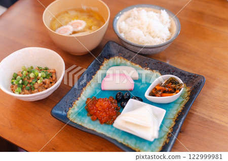 Japanese breakfast table: miso soup, rice and colorful side dishes Japanese breakfast table: miso soup, rice and colorful side dishes 122999981