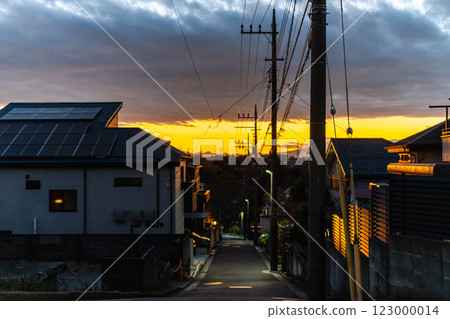 A detached house and a beautiful sky in the sunset A detached house and a beautiful sky in the sunset 123000014