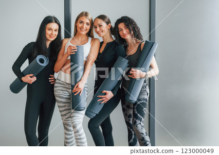 Friends is in the gym together. Women in sportive clothes standing in the fitness center Friends is in the gym together. Women in sportive clothes standing in the fitness center 123000049