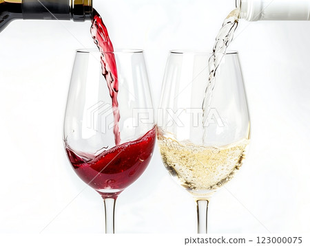 White and red wine poured into glasses, white background 123000075