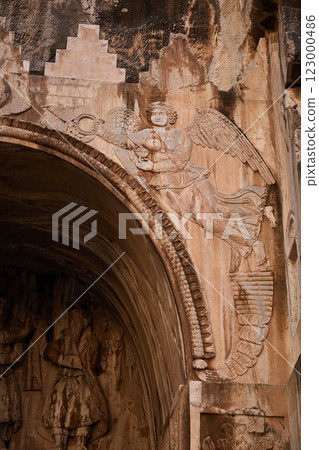 Angel relief in Taq-e Bostan in Kermanshah city, Iran Angel relief in Taq-e Bostan in Kermanshah city, Iran 123000486