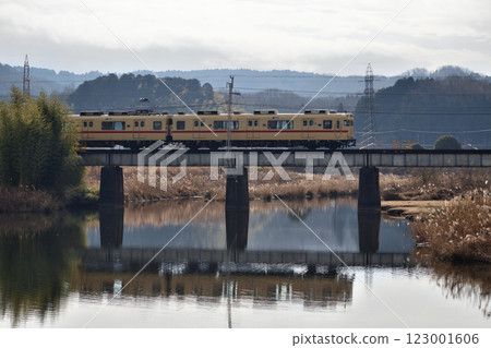 Regional railway train crossing a railway bridge 123001606