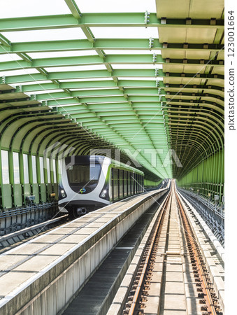 A Green Line train running on the elevated track of the Taichung Rapid Transit System in Taiwan.  123001664