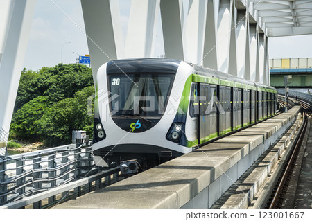 A Green Line train running on the elevated track of the Taichung Rapid Transit System in Taiwan.  123001667