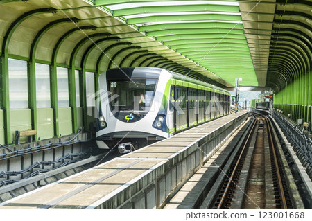A Green Line train running on the elevated track of the Taichung Rapid Transit System in Taiwan.  123001668