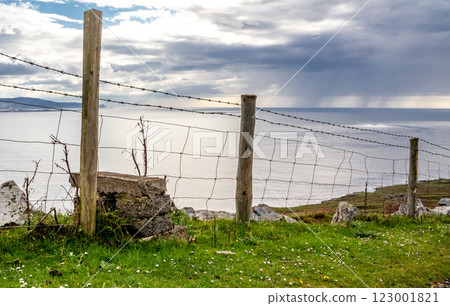 Fence next to the coastal single track road between Meenacross and Crohy Head south of Dungloe, County Donegal - Ireland 123001821