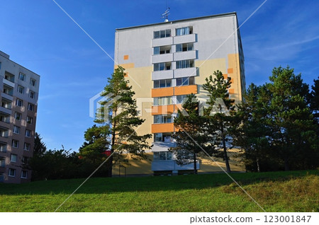 Original prefabricated houses on a housing estate from the communist era in Eastern and Central Europe after reconstruction.. Facade of a modern apartment building with windows and balconies. Czech Original prefabricated houses on a housing estate from the communist era in Eastern and Central Europe after reconstruction.. Facade of a modern apartment building with windows and balconies. Czech 123001847