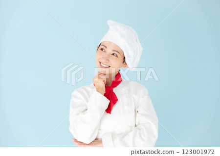 Female chef cook coat grinning 123001972