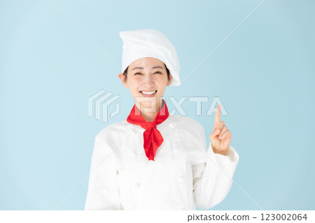 Female chef cook coat pointing 123002064