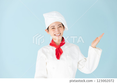 Female chef cook coat hand wave Female chef cook coat hand wave 123002072