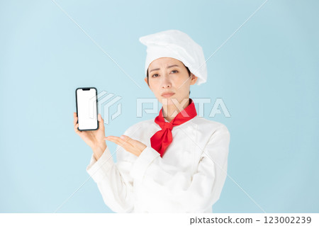 Female chef cook coat smartphone worries Female chef cook coat smartphone worries 123002239