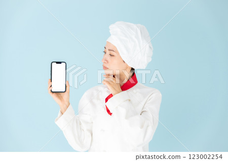 Female chef cook coat smartphone worries Female chef cook coat smartphone worries 123002254