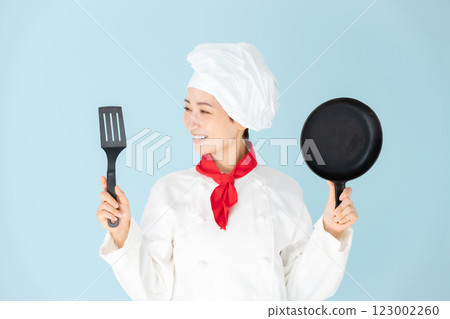Female chef cook coat cooking Female chef cook coat cooking 123002260