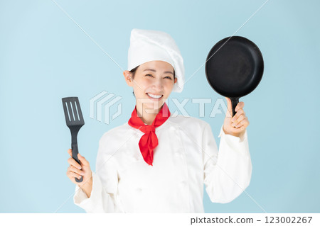 Female chef cook coat cooking Female chef cook coat cooking 123002267