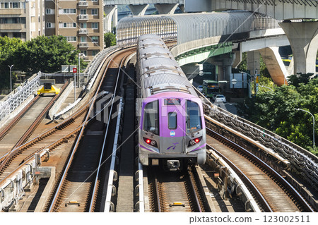 View of a Taoyuan International Airport line train running on the elevated track of the Taoyuan Mass Rapid Transit System. 123002511