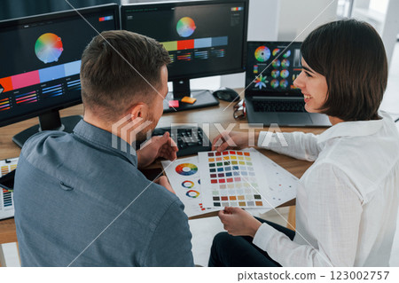 Top view. Two designers working together in the office 123002757
