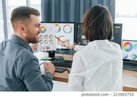 Positive communication. Two designers working together in the office 123002758