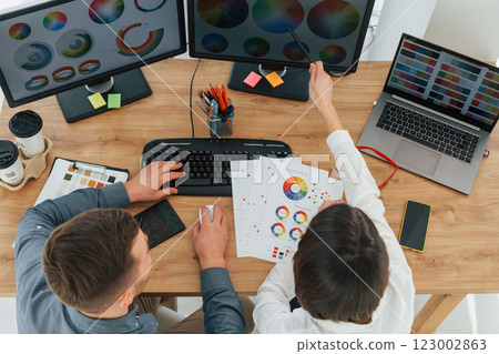 Top view. Two designers working together in the office Top view. Two designers working together in the office 123002863