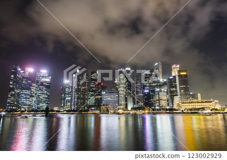 Night view of the Marina Bay Financial Centre and the Raffles Place modern office skyscrapers in Singapore. Night view of the Marina Bay Financial Centre and the Raffles Place modern office skyscrapers in Singapore. 123002929