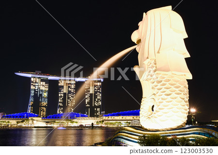 Low-angle view of the Merlion with the background of Marina Bay Sands buildings in Singapore. Merlion is the official mascot of Singapore. 123003530