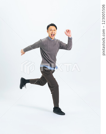 Full body photo of a middle-aged man in casual wear running Full body photo of a middle-aged man in casual wear running 123005506