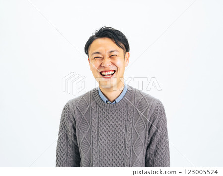 Middle-aged man smiling cheerfully Middle-aged man smiling cheerfully 123005524