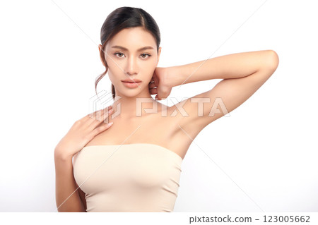 Beautiful Young Asian woman lifting hands up to show off clean and hygienic armpits or underarms on white background, Smooth armpit cleanliness and protection concept 123005662