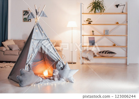Tent with lamb in it is in the domestic room. No people Tent with lamb in it is in the domestic room. No people 123006244