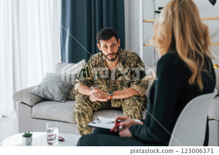 Soldier have therapy session with psychologist indoors 123006371