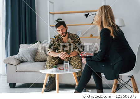 Having conversation. Soldier have therapy session with psychologist indoors 123006375