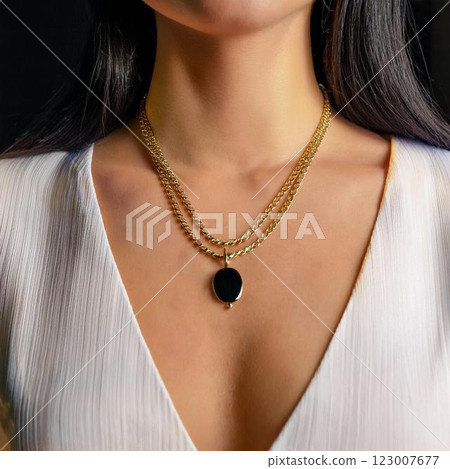 Elegant layered gold necklace with black gems 123007677