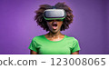 Teenager black girl experiencing virtual reality with joyful expression 123008065