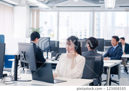 Female call center staff experiencing customer harassment Female call center staff experiencing customer harassment 123008585
