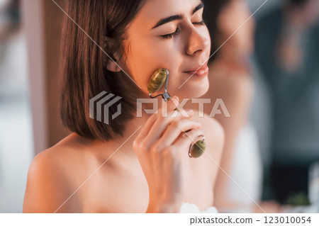 Clean skin. Young woman is at home. Conception of beauty Clean skin. Young woman is at home. Conception of beauty 123010054