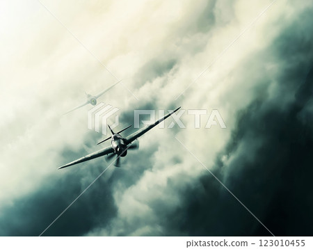 Two World War II fighter planes flying through heavy storm clouds with a moody atmosphere 123010455